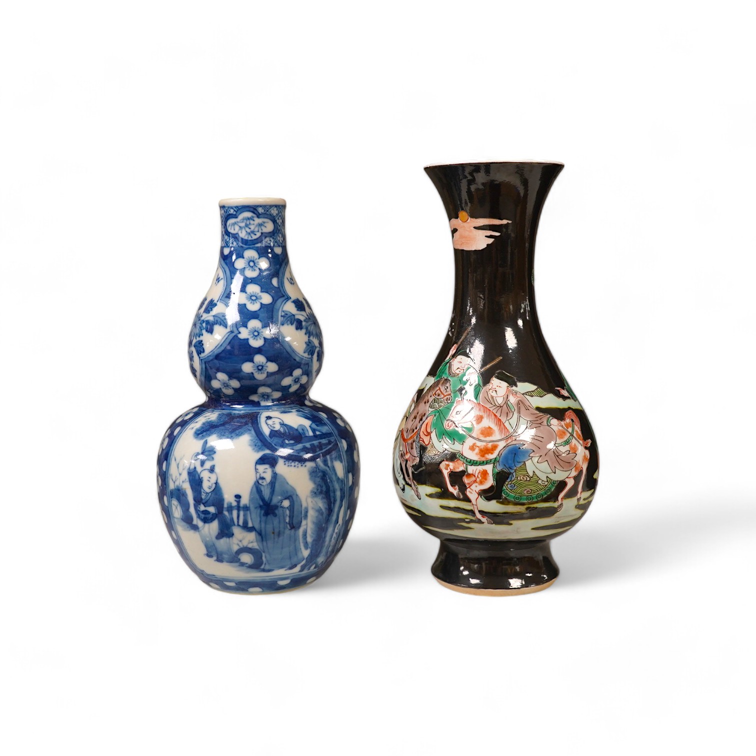 Two Chinese vases; a blue and white double gourd vase and famille noir vase, famille noir 19cm high. Condition - good